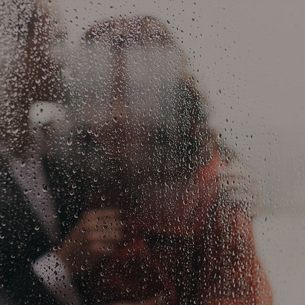 man and woman in rain